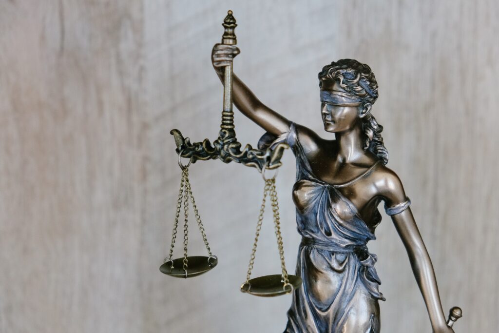 Lady Justice with blind fold, holding scales of justice