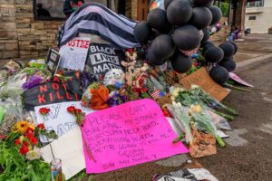 A memorial outside Cup Foods near 38th and Chicago Avenue South in Minneapolis, Minnesota, the site where a white Minneapolis police officer pressed his knee into the neck of George Floyd—an unarmed, handcuffed black man's neck, killing him.