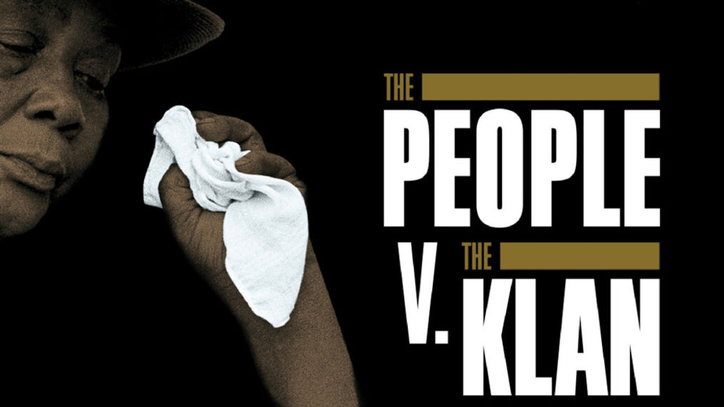 Press release photo for The People V. The Klan, a CNN original documentary series. Image shows a black woman wiping off tears with a white handkerchief, and the title includes the words "They took her son, she took them down".