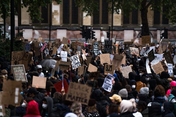 Crowd of people holding BLM signs.